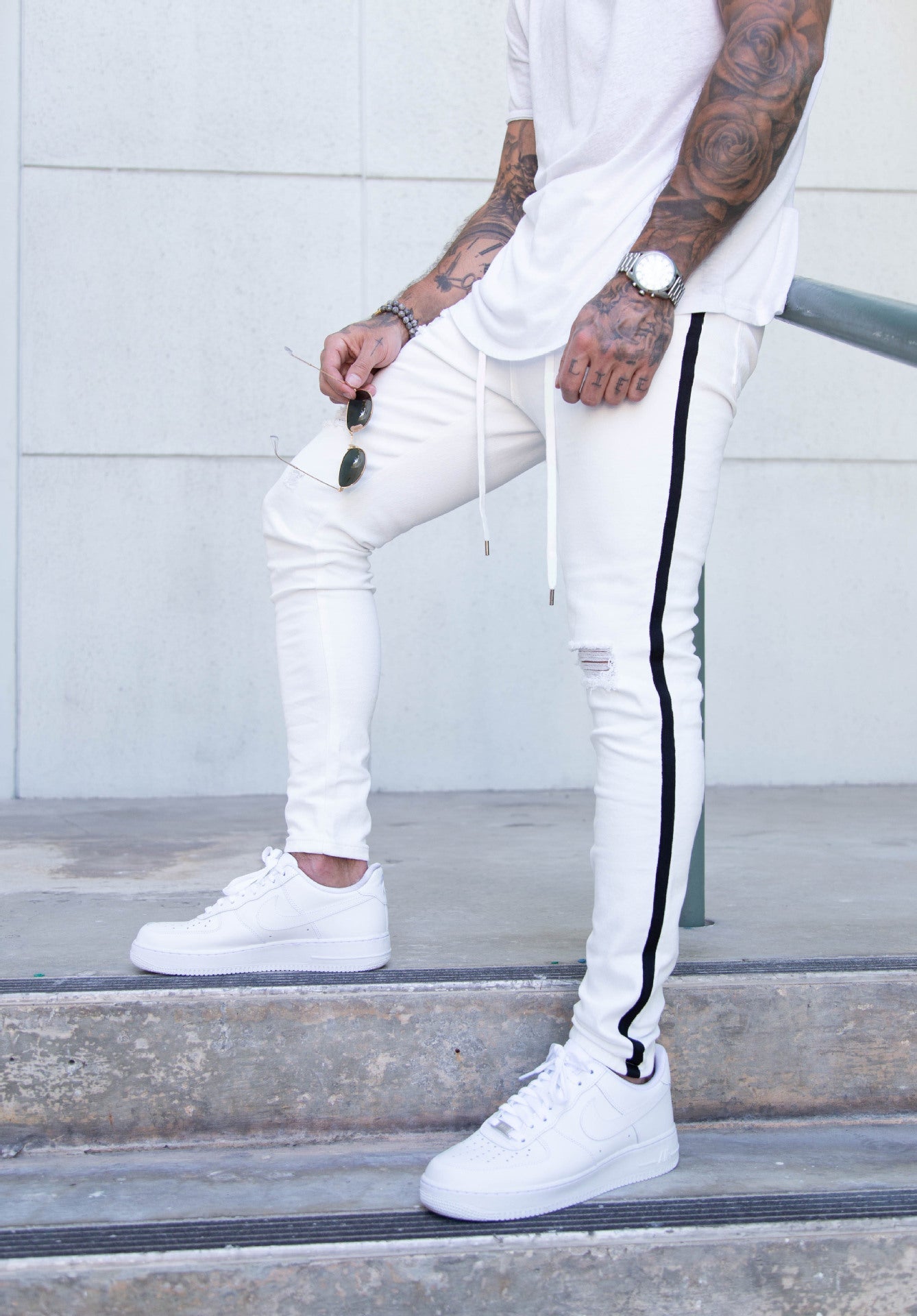 Slim-fit ripped lace-up jeans