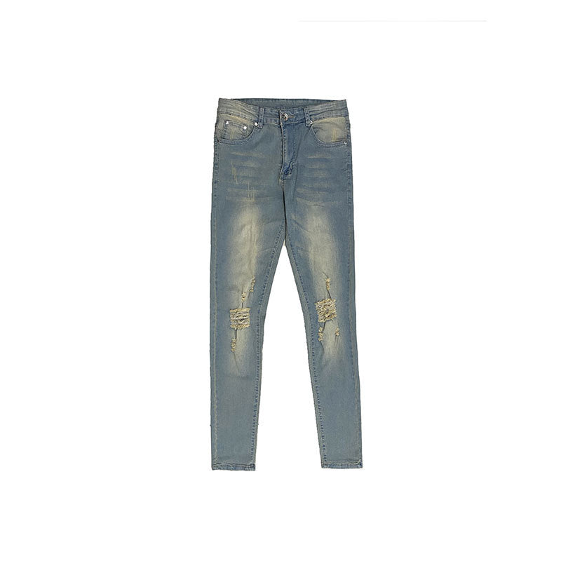 Washed yellowish worn slim fit frayed jeans